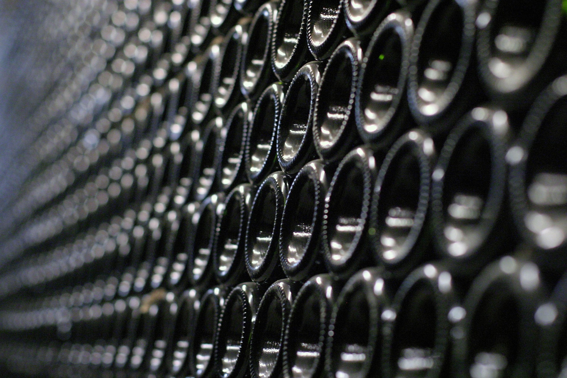 Stacked bottles in a cellar, side-lit